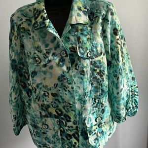 Chico size 1 light multicolor jacket. Colors are bluish green , yellow and white